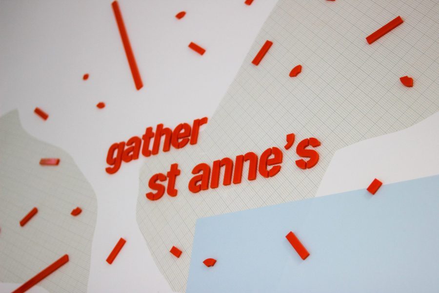 A wall with 'gather st anne's' in red script