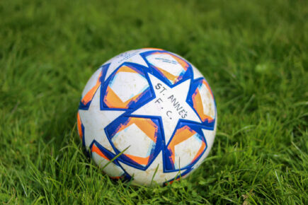 A football with 'St Annes F.C.' written on with sharpie at St Anne's Park