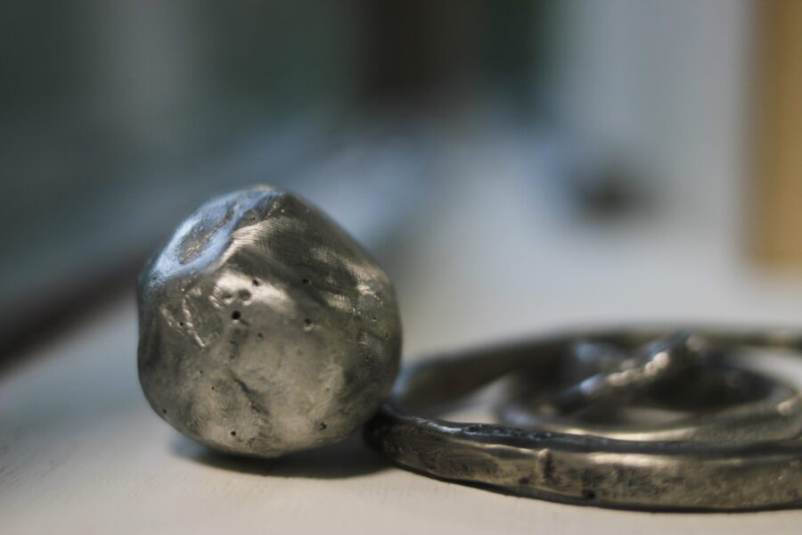 A close up of a pewter casts artwork in Curio.