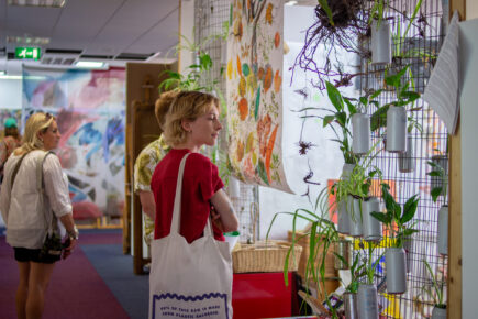 Two people looking into a studio space at St Anne's House during the Open House event