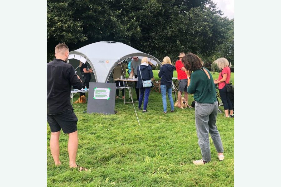 People at St Anne's Park around a tent to discuss ideas for St Anne's House